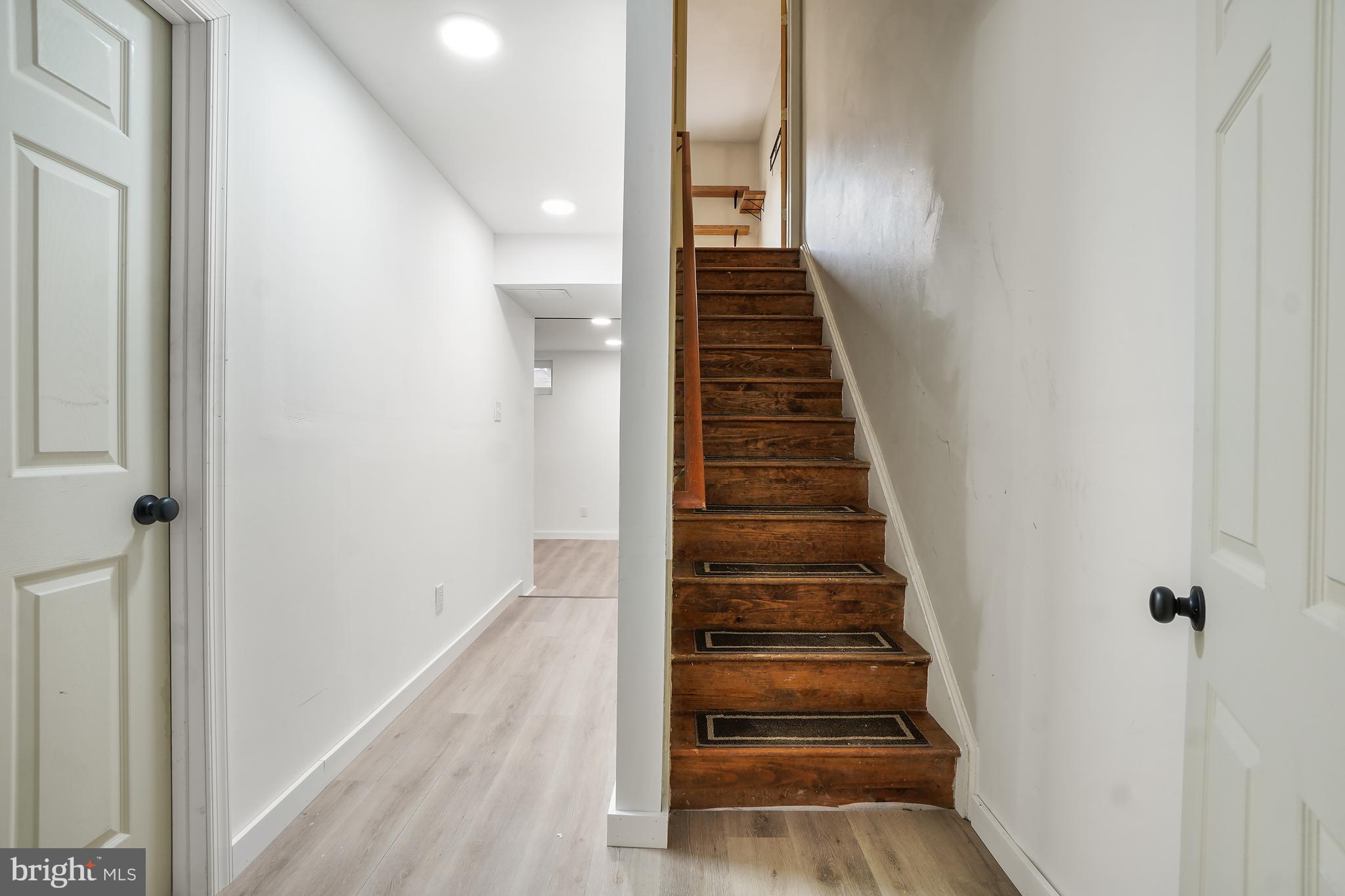7994 Windsail Court Frederick, MD 21701 - Photo 35 of 46 a view of entryway and gallery with wooden floor