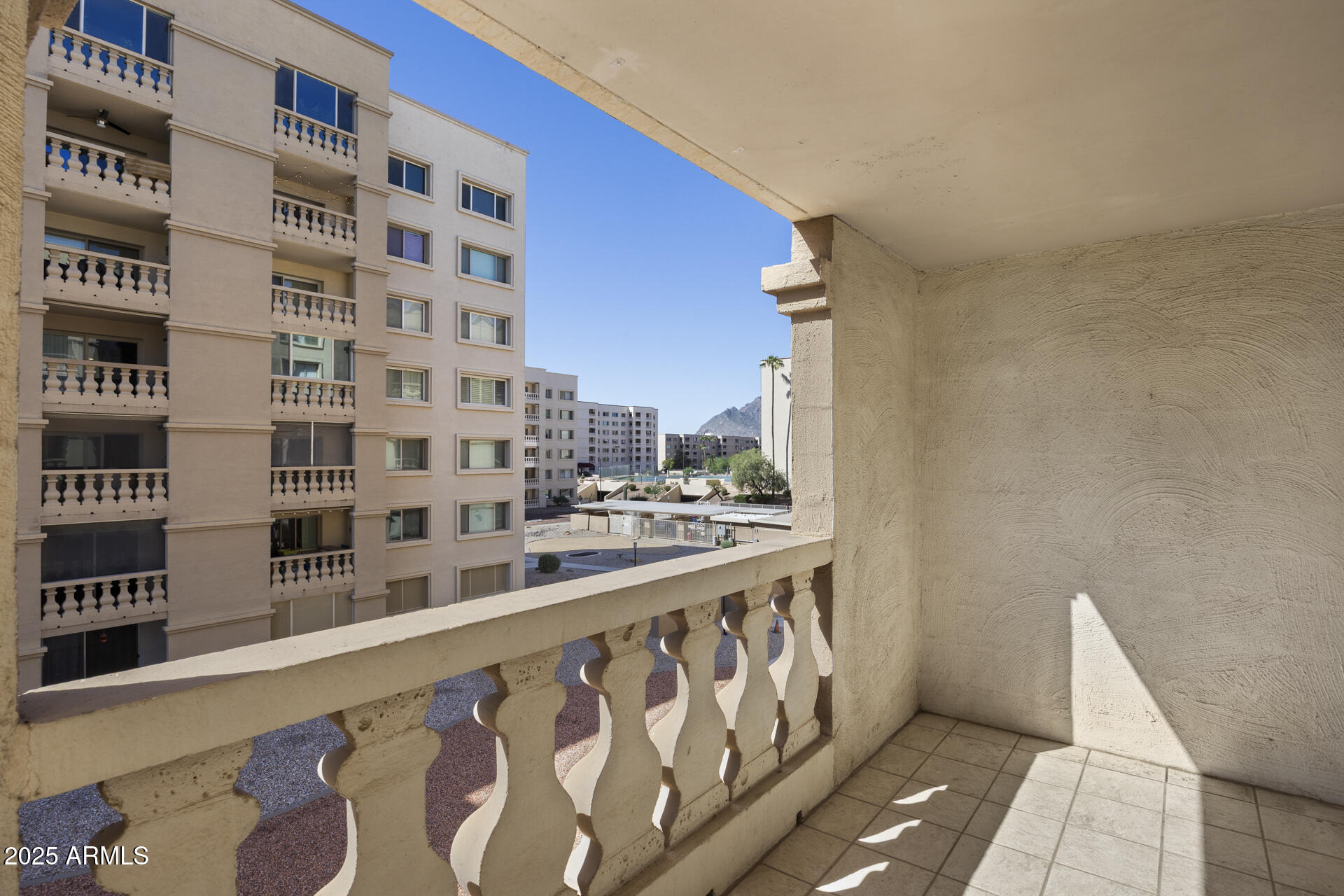 7960 East Camelback Road, Unit 309 Scottsdale, AZ 85251 - Photo 19 of 29 Balcony w/Pool & Camelback Views