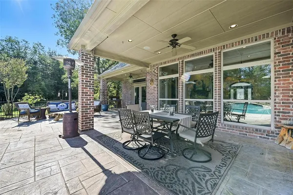 a aerial view of a house with swimming pool garden and patio