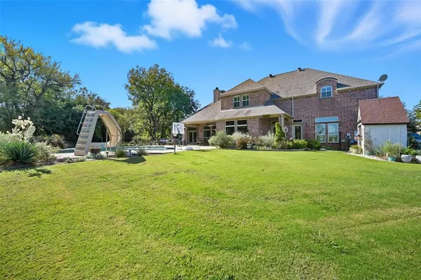 a view of a swimming pool with a lounge chairs