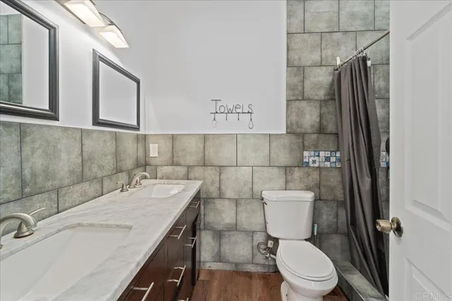 a bathroom with a sink and toilet