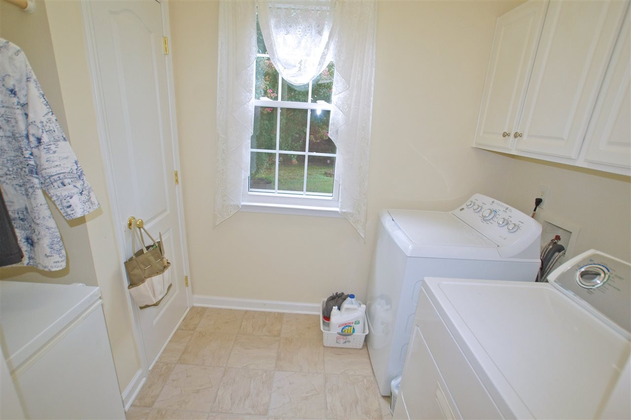 7540 Silver View Lane Raleigh, NC 27613 - Photo 16 of 29 Laundry/Mud room with plenty of cabinet storage. Laundry/Mud Room
