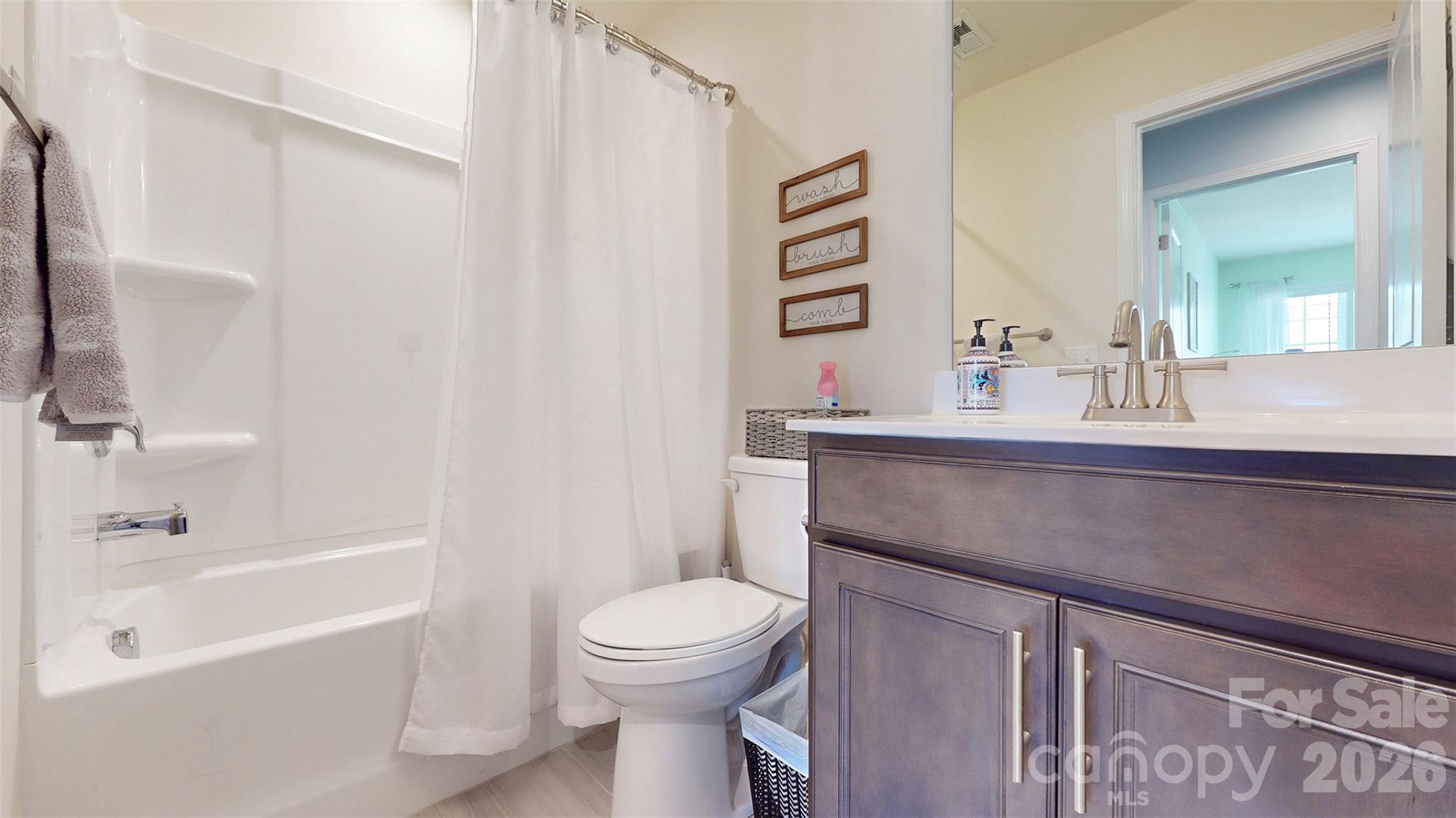 827 Canoe Song Road Fort Mill, SC 29708 - Photo 27 of 33 a bathroom with a sink a toilet and a bathtub