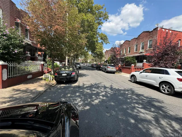 a view of street with parked cars