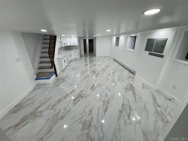 a view of a hallway with seating space