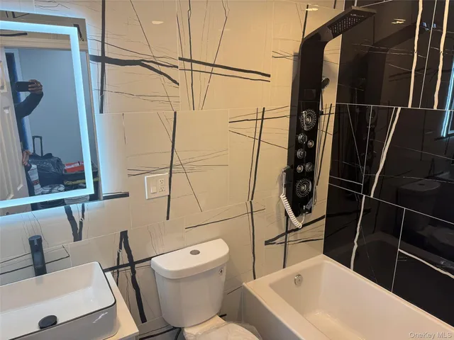 a bathroom with a toilet and a sink