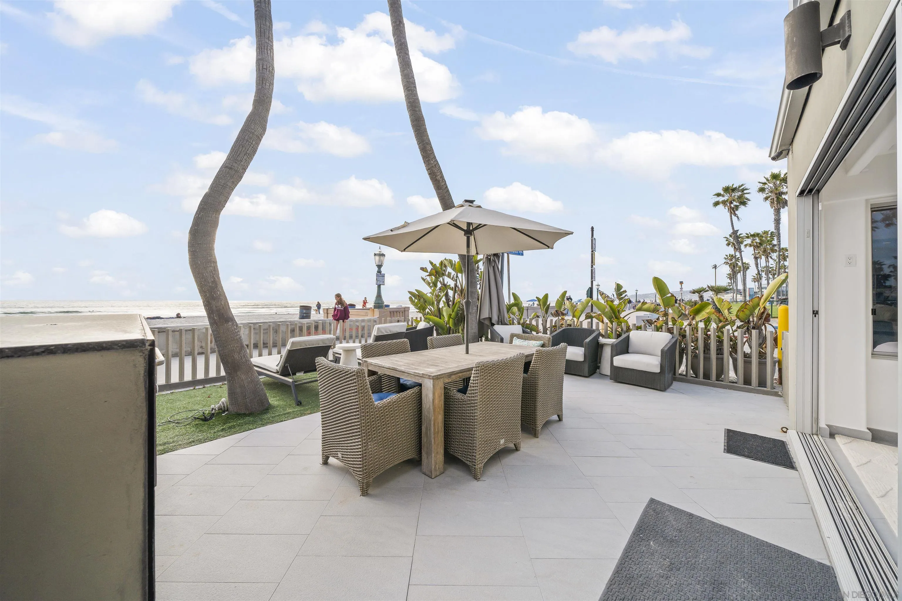 2999 Ocean Front Walk, Unit 1 San Diego, CA 92109 - Photo 11 of 37 a view of a patio with chairs and potted plants