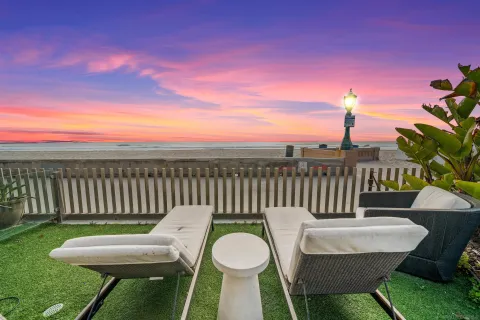 a view of a chairs and table in the backyard