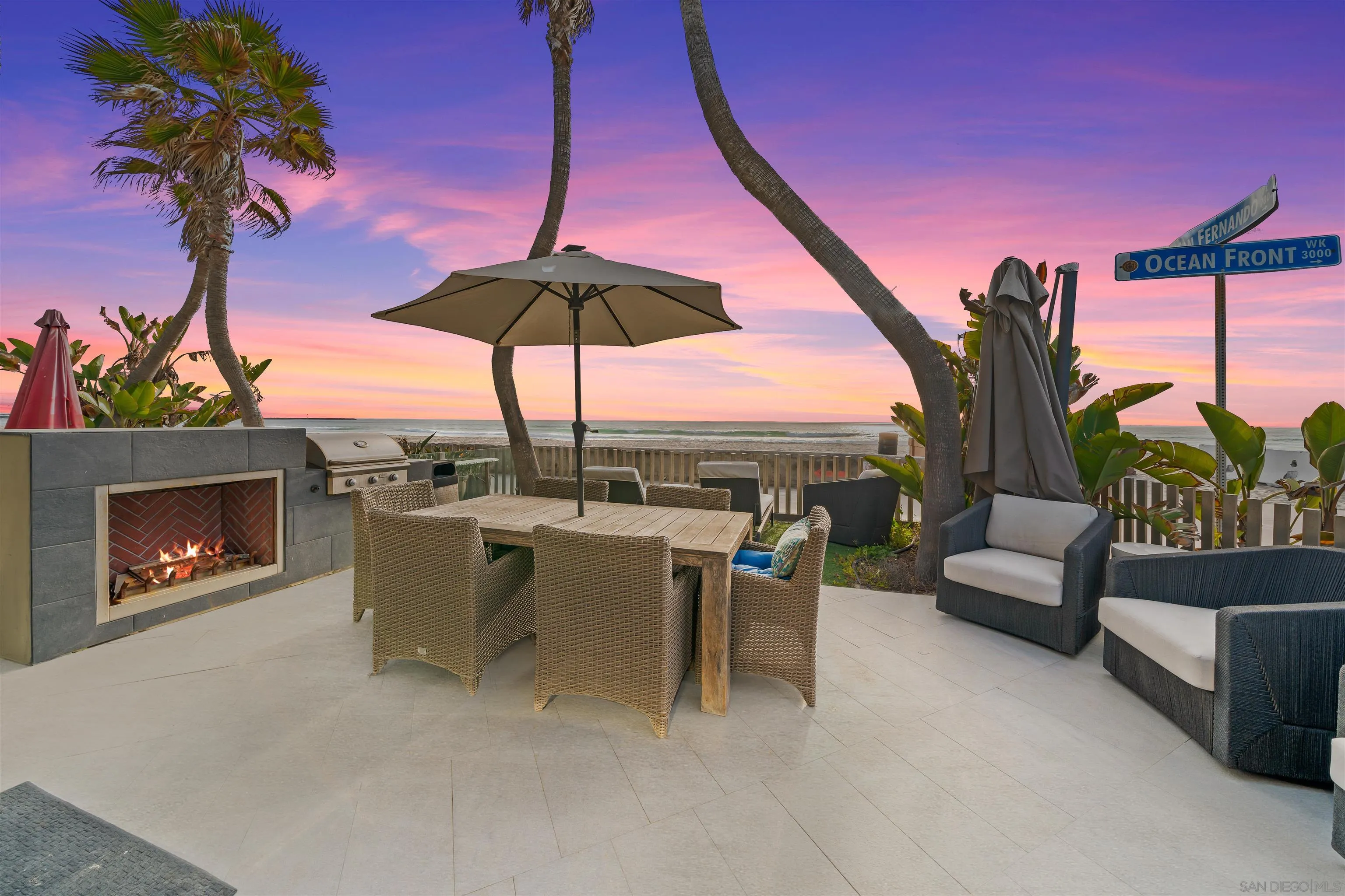 2999 Ocean Front Walk, Unit 1 San Diego, CA 92109 - Photo 13 of 37 a view of a terrace with furniture and a fire pit