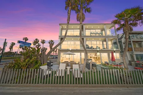 a front view of a building with a garden