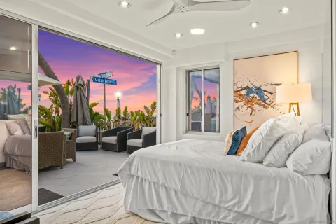 a bedroom with a large bed and a large window