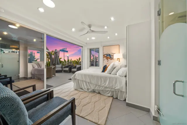 a living room with furniture gym equipment and a ceiling fan