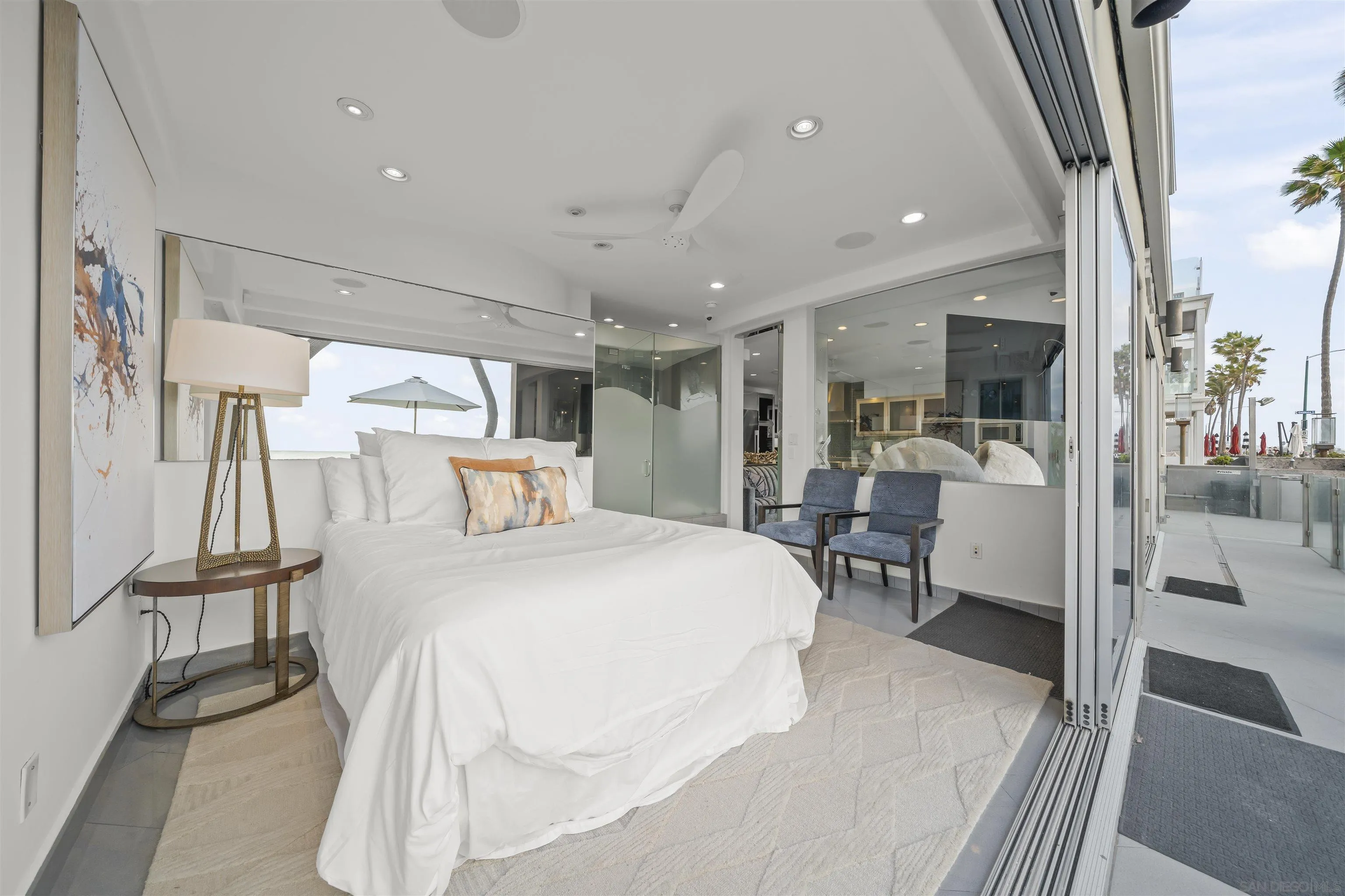 2999 Ocean Front Walk, Unit 1 San Diego, CA 92109 - Photo 18 of 37 a room with a bed and a table