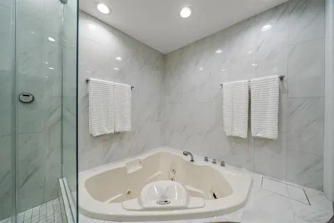 a bathroom with a bathtub and shower
