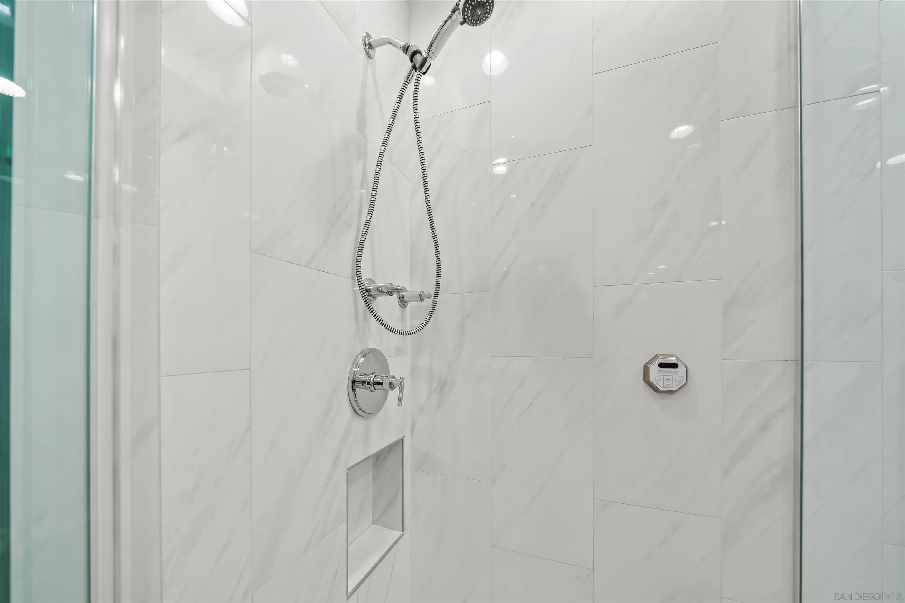 2999 Ocean Front Walk, Unit 1 San Diego, CA 92109 - Photo 26 of 37 a bathroom with a shower and a shower head