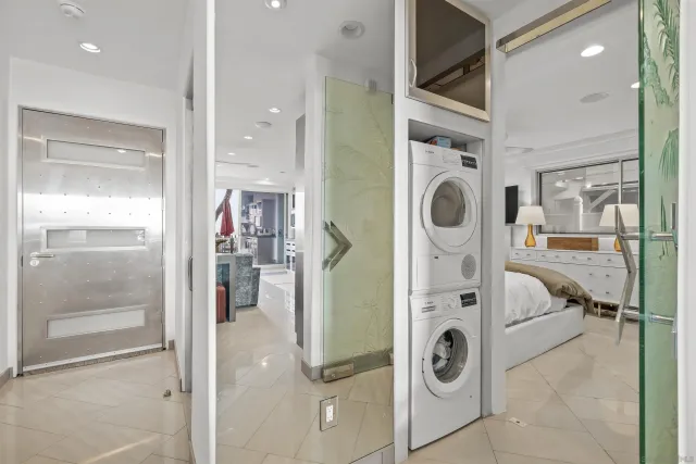 a view of a hallway with washer and dryer