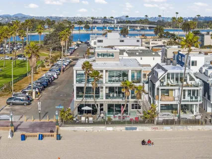 a front view of a multi story residential apartment building with a yard