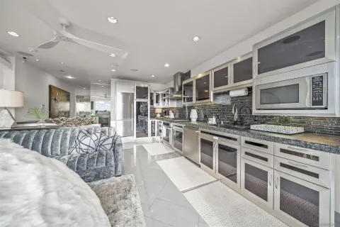a kitchen with stainless steel appliances granite countertop a stove and a sink