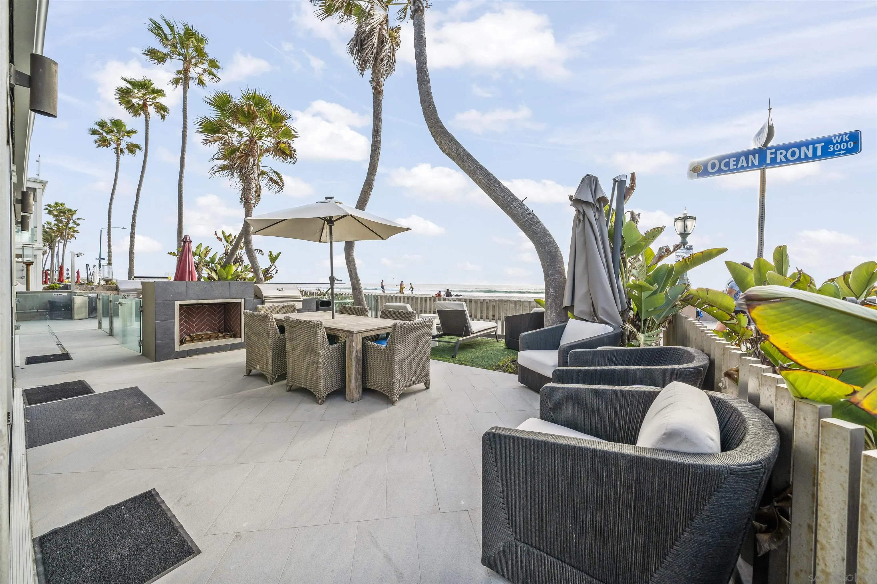 2999 Ocean Front Walk, Unit 1 San Diego, CA 92109 - Photo 8 of 37 a dining room with furniture and a floor to ceiling window