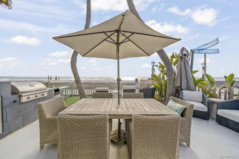a view of outdoor kitchen with seating area