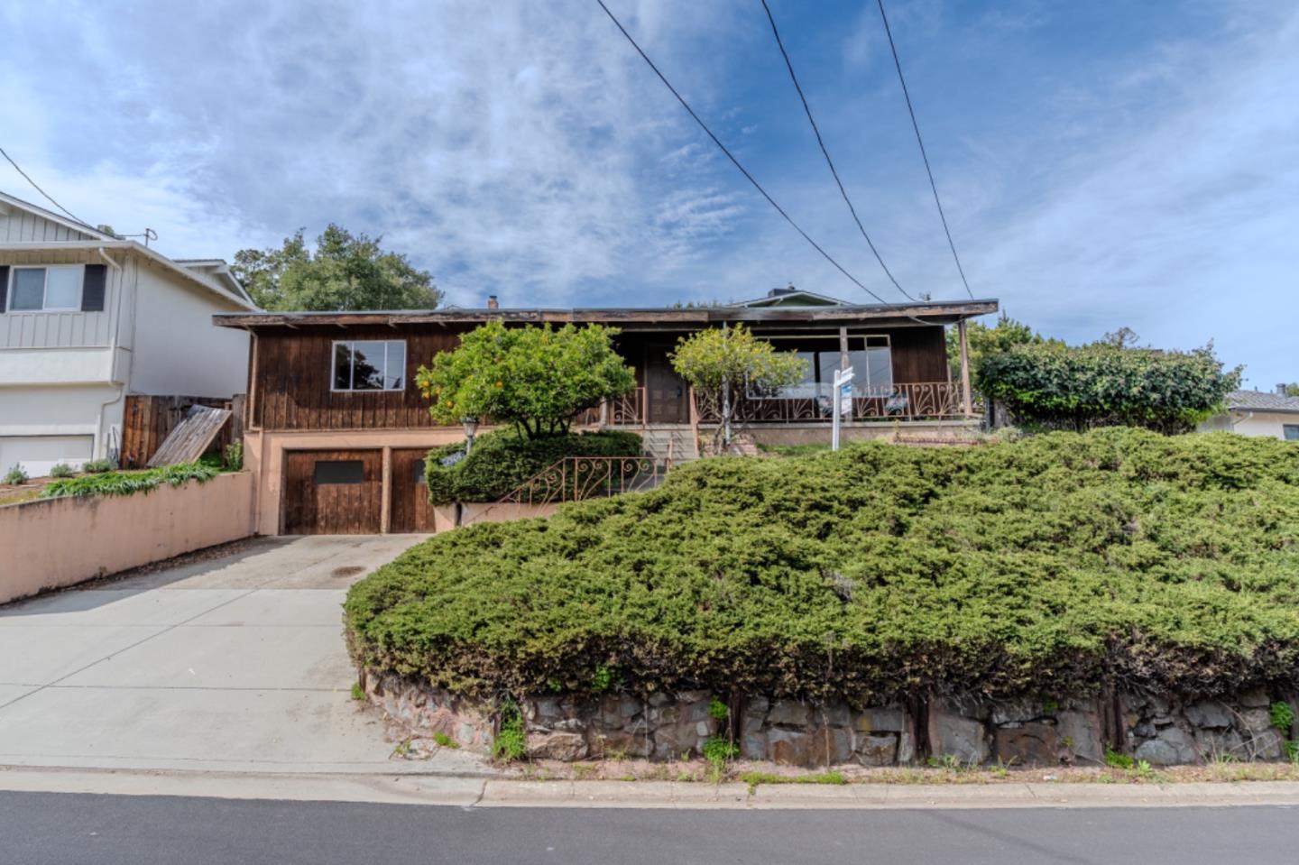 a front view of house with a yard