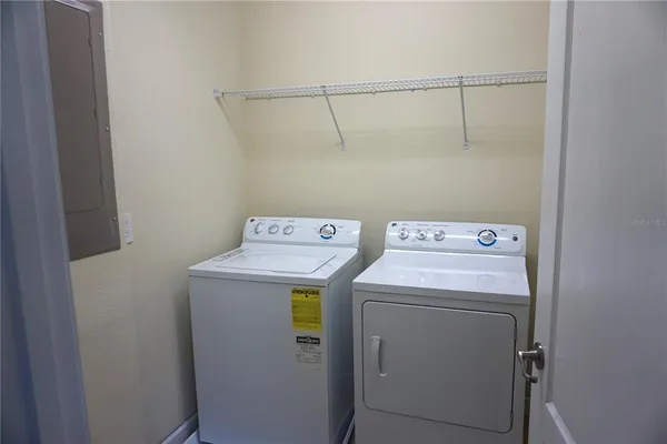 a utility room with dryer and washer