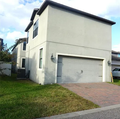 a view of a backyard of the house