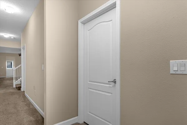 a view of a hallway with closet area