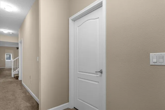 a view of a hallway with closet area