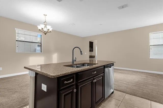 a kitchen with a sink and a stove