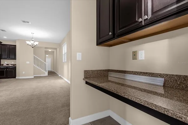 a view of kitchen and utility room