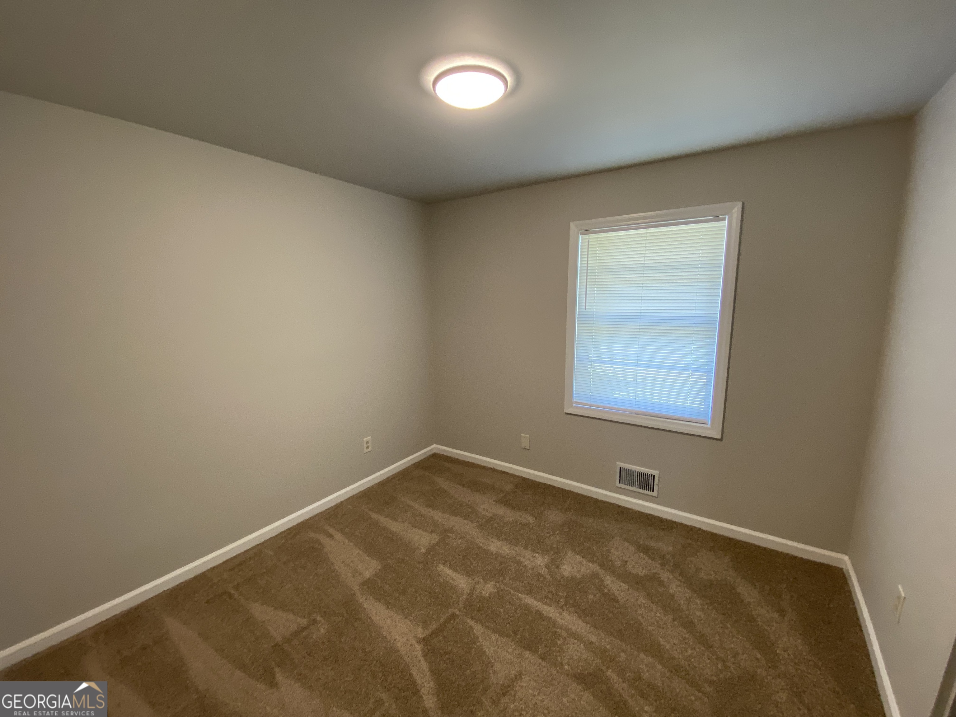 6092 Prestige Valley Road Morrow, GA 30260 - Photo 5 of 11 an empty room with a window