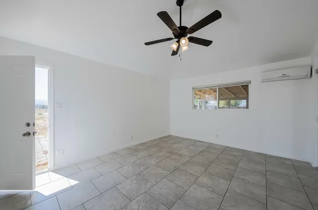 an empty room with a bench