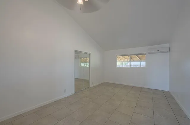 a bathroom with a shower toilet and sink