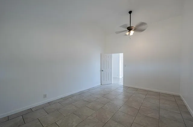 a kitchen with granite countertop a stove a sink and a granite counter tops