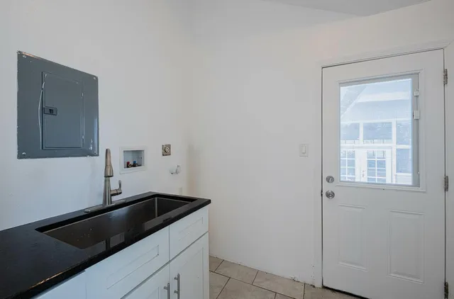 a view of a kitchen with microwave and cabinets