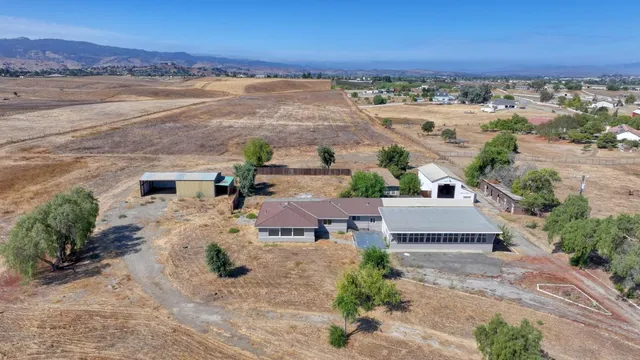 an aerial view of house with ocean view