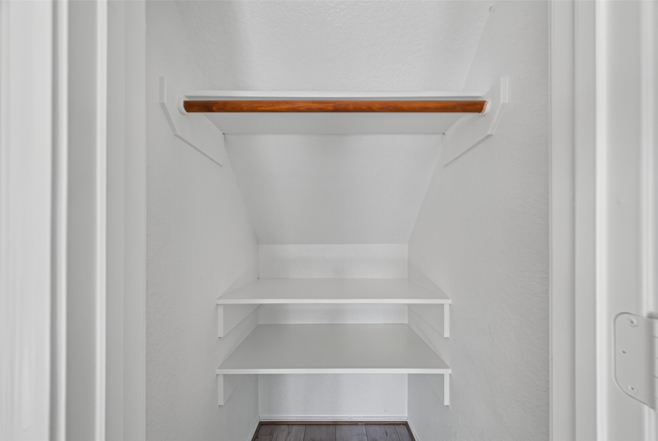 7926 Sundance Court Baytown, TX 77521 - Photo 10 of 32 a view of walk in closet with empty racks