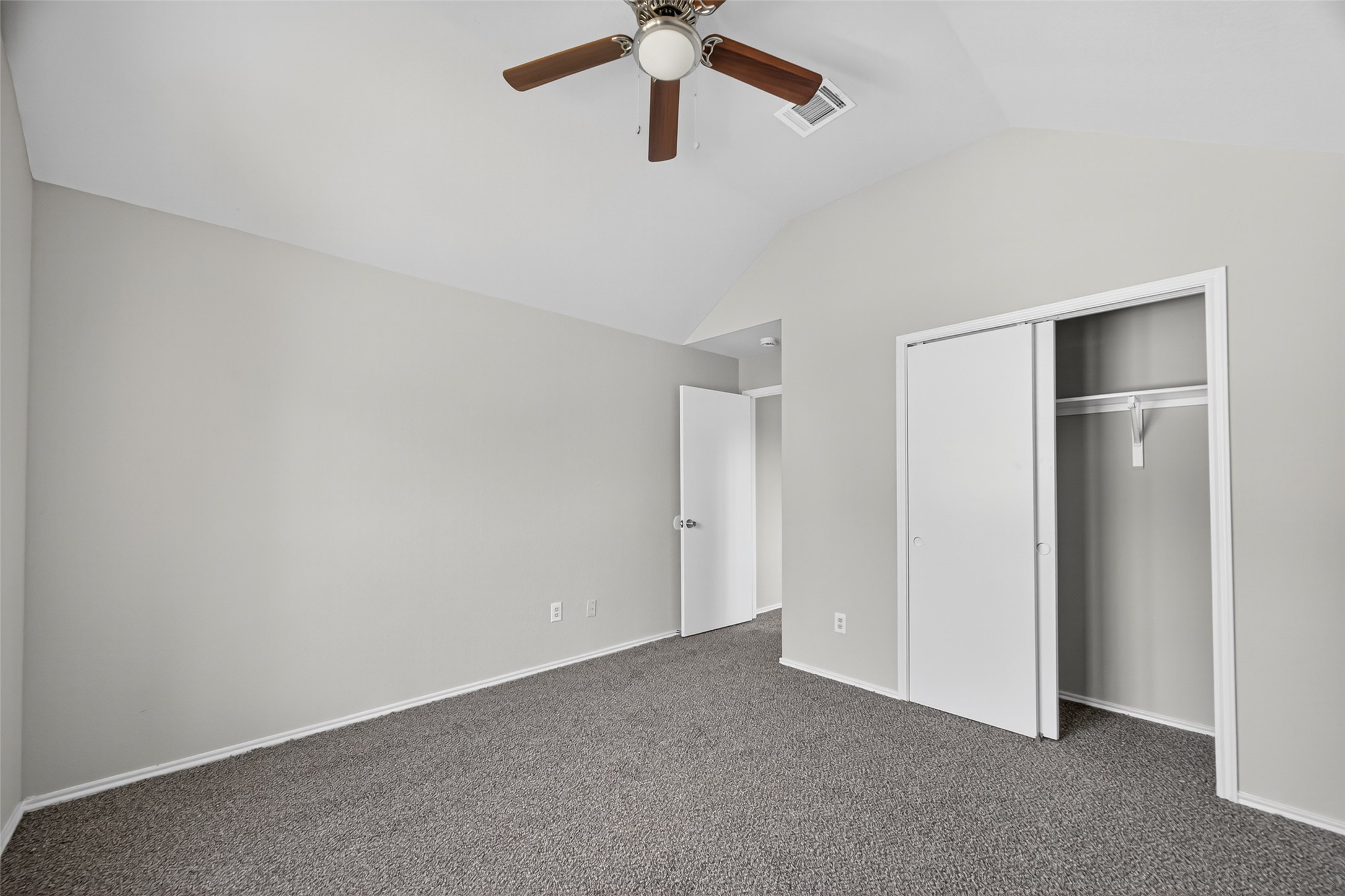 7926 Sundance Court Baytown, TX 77521 - Photo 14 of 32 a view of an empty room with a ceiling fan