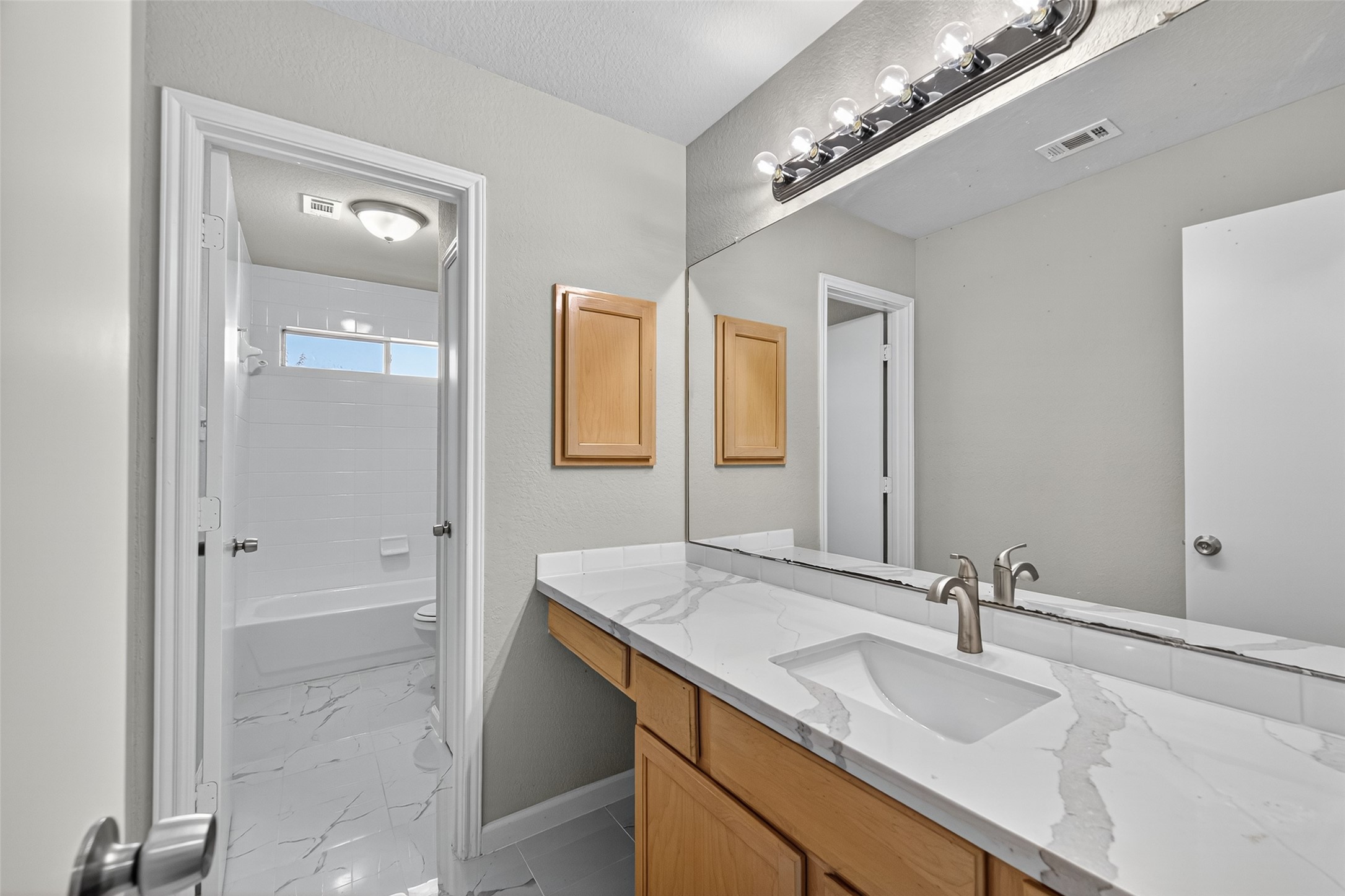 7926 Sundance Court Baytown, TX 77521 - Photo 19 of 32 a bathroom with a sink double vanity and a mirror