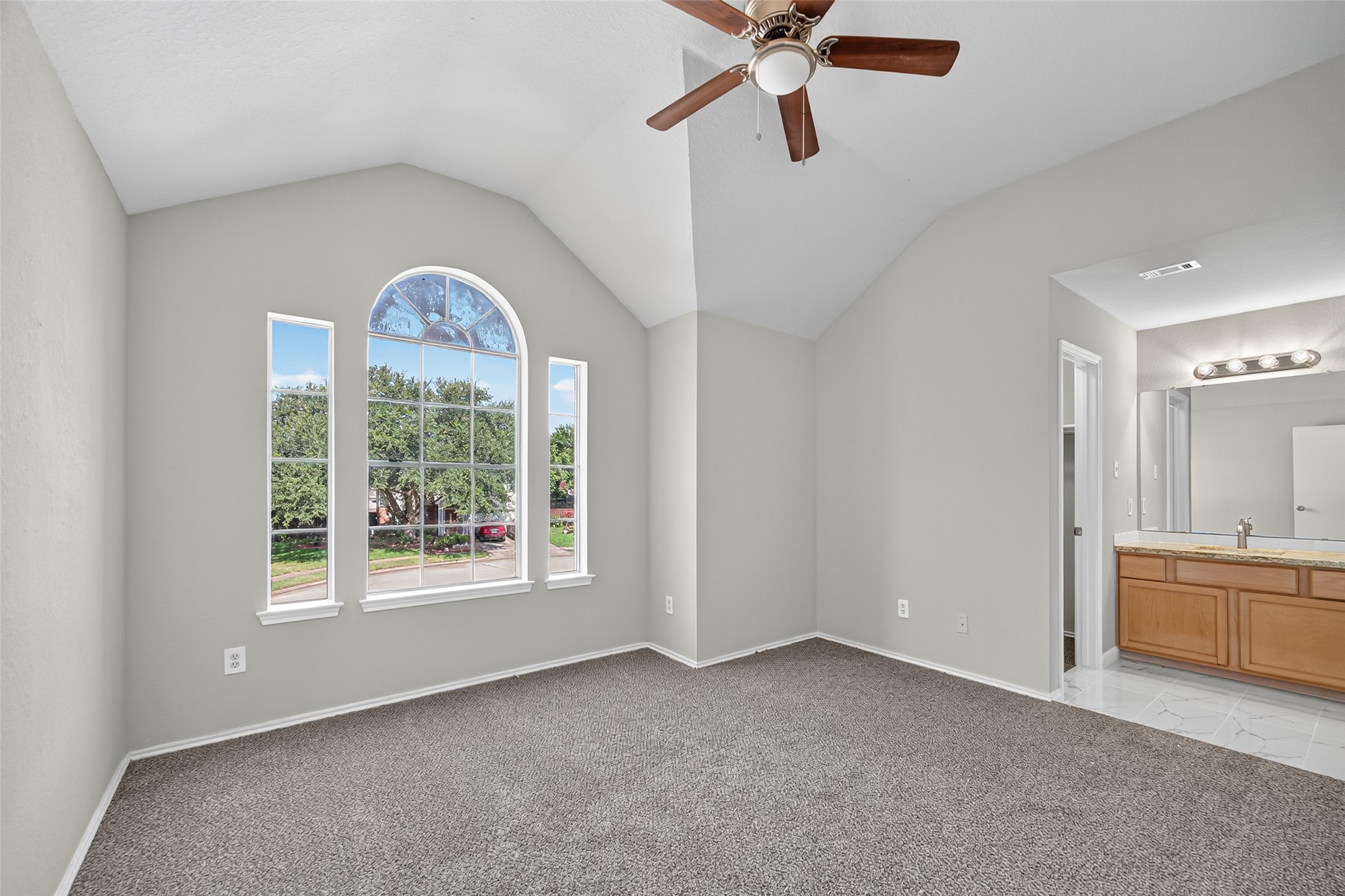 7926 Sundance Court Baytown, TX 77521 - Photo 21 of 32 a view of a livingroom with a ceiling fan and window