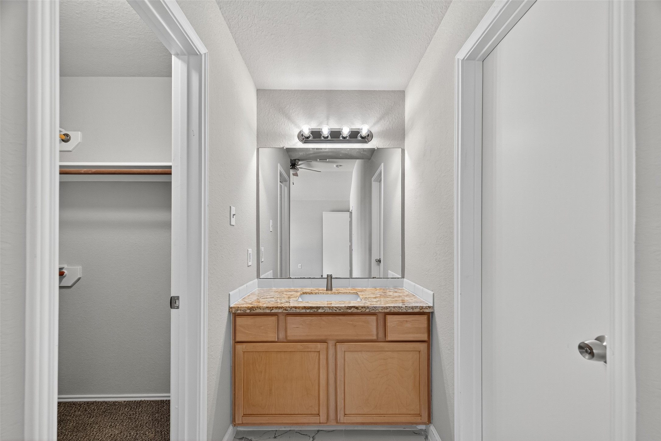 7926 Sundance Court Baytown, TX 77521 - Photo 23 of 32 a bathroom with a sink and a mirror