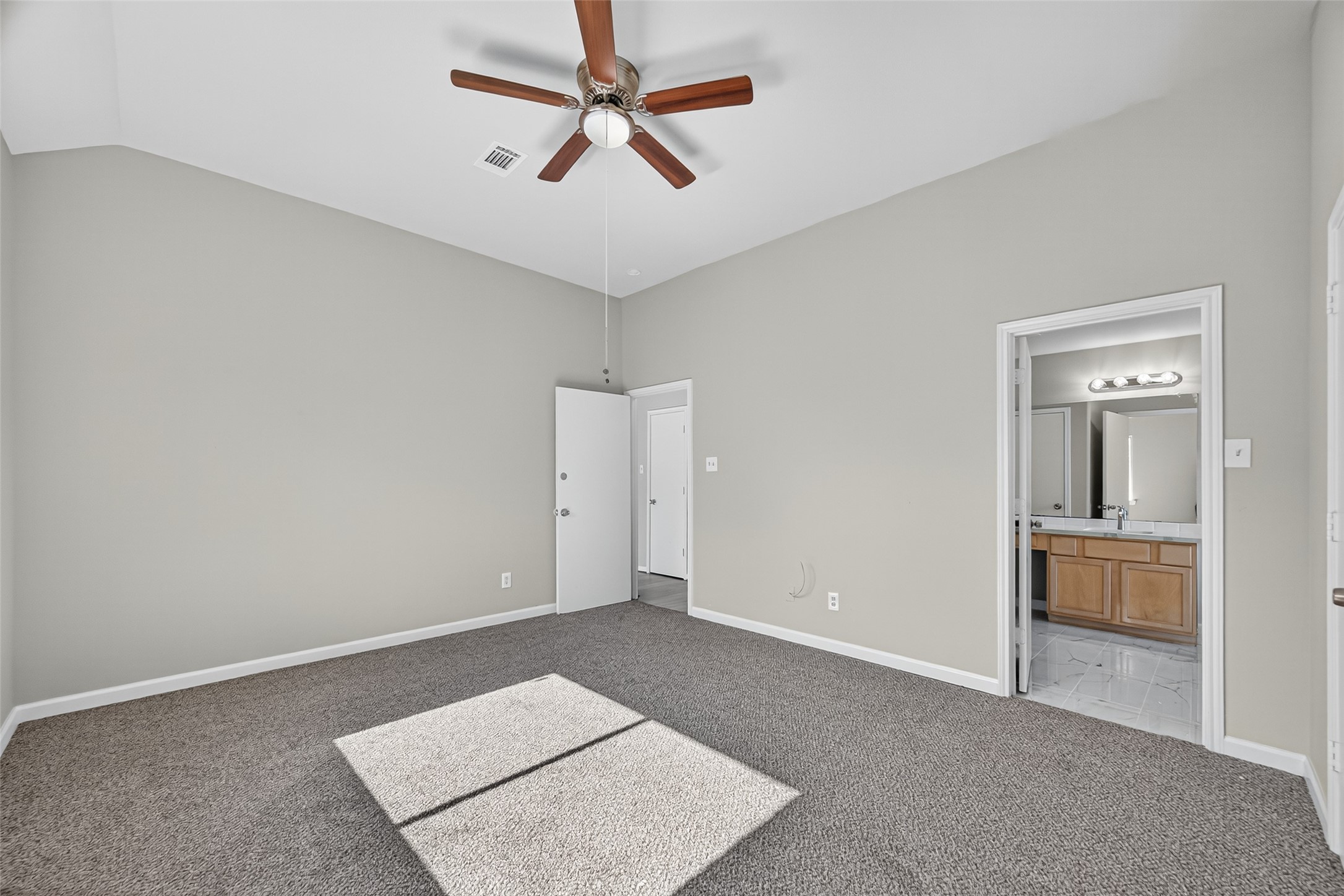 7926 Sundance Court Baytown, TX 77521 - Photo 26 of 32 an empty room with closet and a chandelier fan
