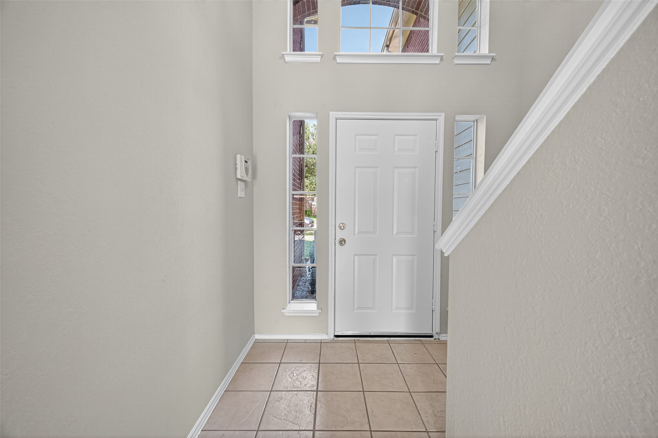 7926 Sundance Court Baytown, TX 77521 - Photo 3 of 32 a view of an entryway with staircase