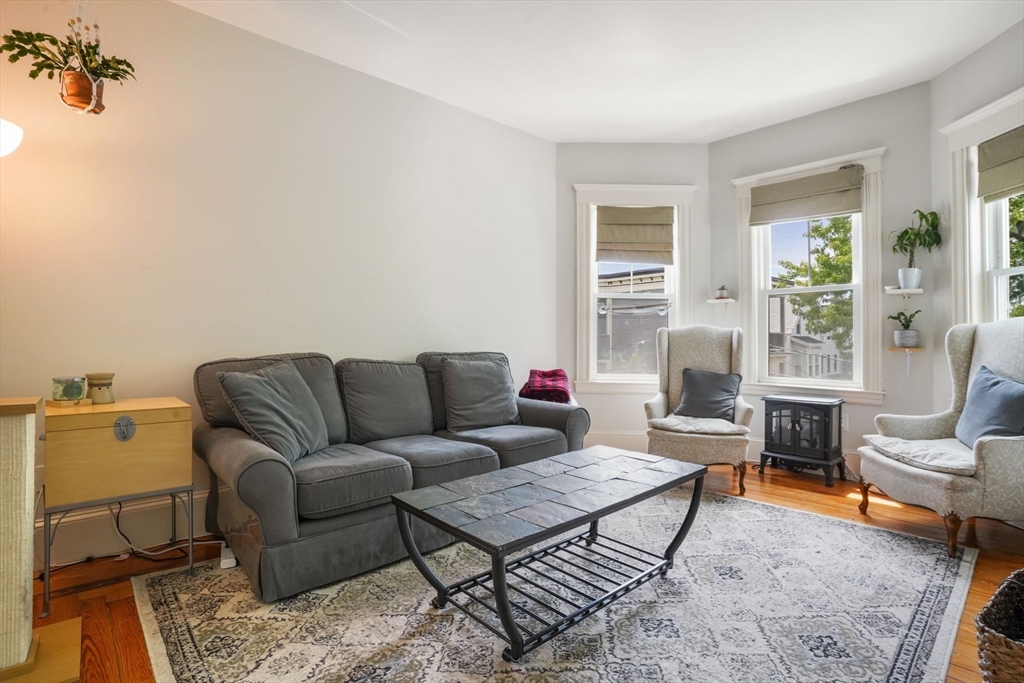 37 Dimick Street, Unit 3 Somerville, MA 02143 - Photo 2 of 12 a living room with furniture and a window