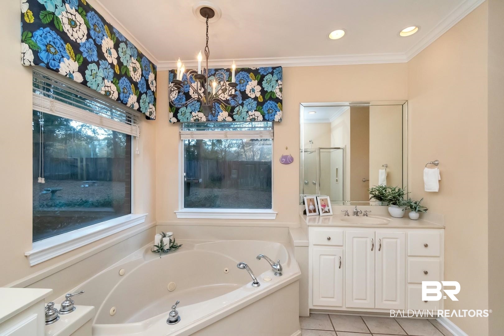 1050 Southern Way Court Mobile, AL 36609 - Photo 16 of 36 Bathroom featuring independent shower and bath, tile patterned flooring, vanity, ornamental molding, and an inviting chandelier