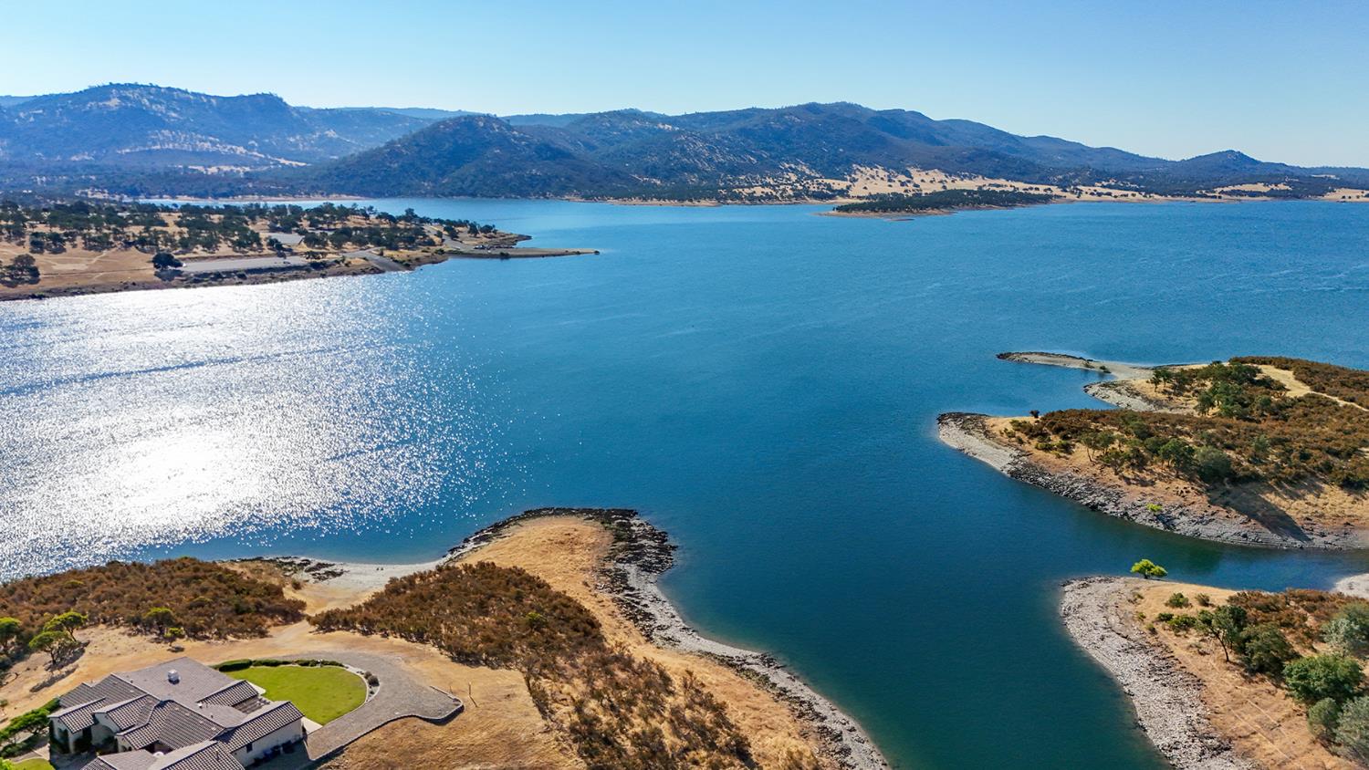 1116 Paradise Peak Road Valley Springs, CA 95252 - Photo 18 of 18 a view of a lake and a mountain