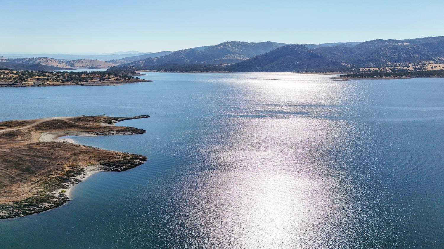 1116 Paradise Peak Road Valley Springs, CA 95252 - Photo 5 of 18 a view of a lake and a mountain