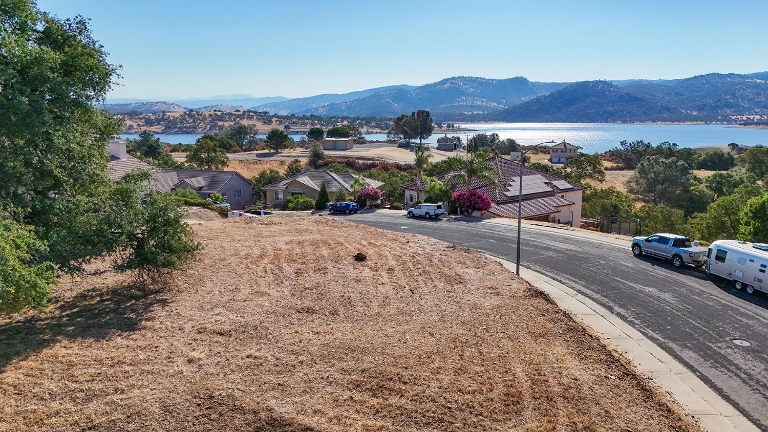 1116 Paradise Peak Road Valley Springs, CA 95252 - Photo 6 of 18 a view of a street with a cars park side of the road