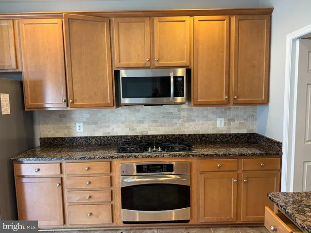 a view of a balcony with two chairs and a table